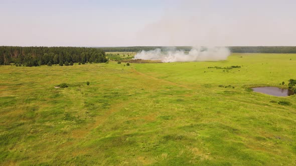 Aerial View Drone Shooting Fire in the Field Dry Grass Burning