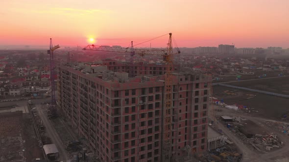 Construction Site in the Middle of the City and Private Houses at Sunset in .