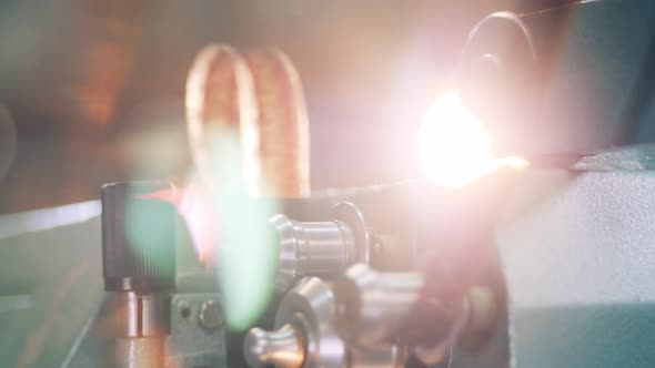 Close Up of an Old Tape Moving Through a Film Projector