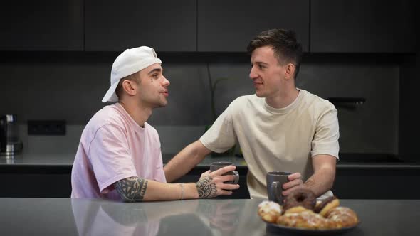 Happy Caucasian Young Tattooed Gay Man Talking with Boyfriend Kissing Partner Smiling