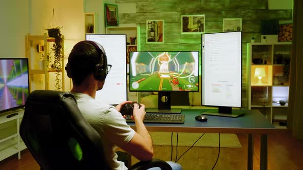 Professional Gamer Using Joystick During a Shooter Championship