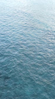 Vertical Video Boats in the Ocean Near the Coast of Zanzibar Tanzania