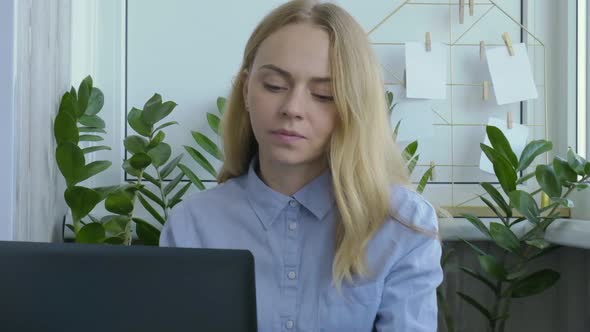 Young Woman Working on a Computer at Home