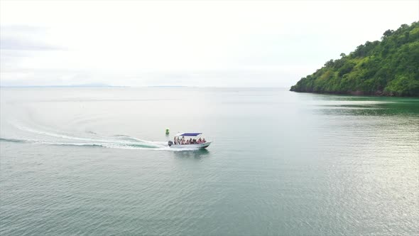 Aerial wide shot of a small motor boat off Madagascar