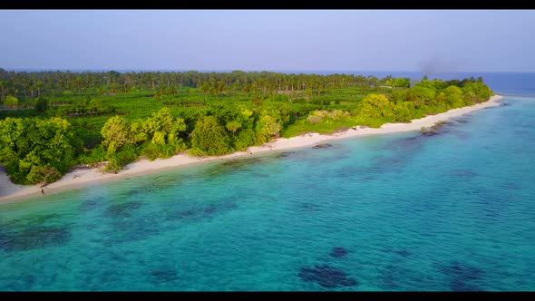 Aerial top view sky of tranquil bay beach break by shallow lagoon and white sand background of a day