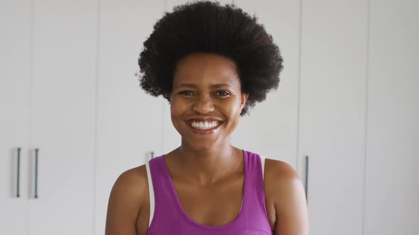 Portrait of happy african american woman looking at camera and smiling