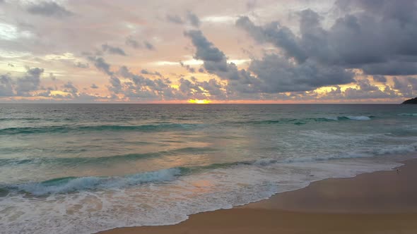 Sea Sunrise And Ripple Waves  Golden Morning Sky And Relaxed Atmosphere On The Beach