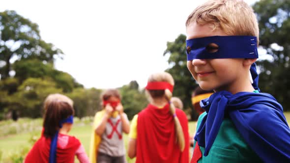 Group of kids pretending to be a super hero