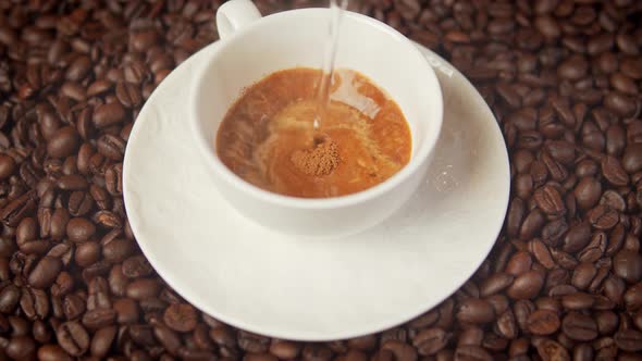  Cup of Delicious Warm and Aromatic Coffee Surrounded By Roasted Seeds