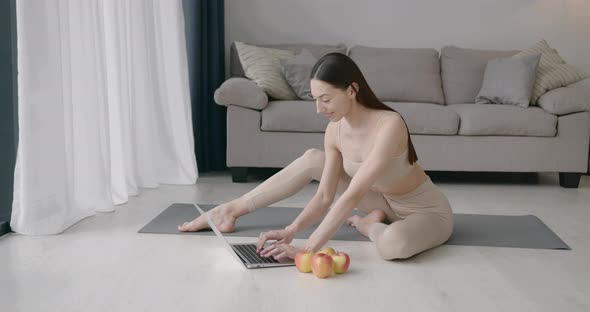 Fir Young Woman Doing Stretching Exercises at Home