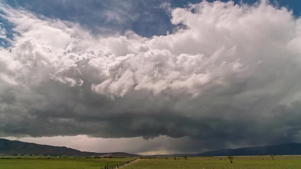 Thunderstorm rolling over the landscape towards and overhead