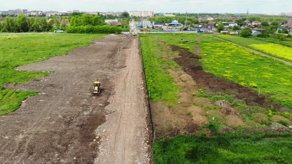 Construction of the road from the air. Aerial view of the building road.