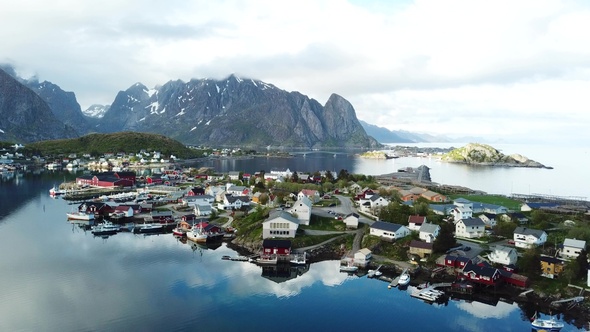 Traditional fishermen's cottages. Small wooden houses on the seashore. Village landscape.