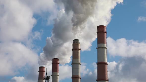 Four Smoking Factory Chimneys