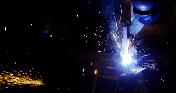 Welders welding a metal