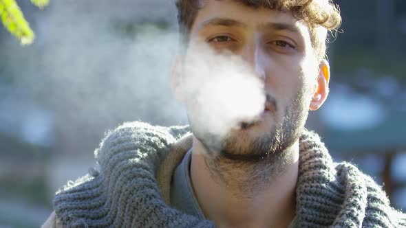 Man blowing smoke