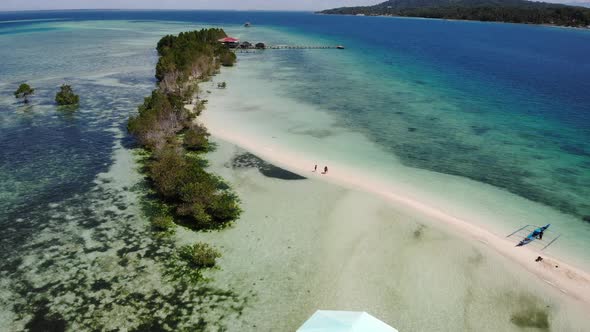 Perishing Island With Crystal Clear Ocean Water Drone Footage