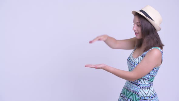 Happy Young Beautiful Tourist Woman Snapping Fingers and Looking Surprised