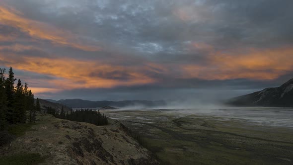 Orange Sunset with Sandstorm in a Valley  Time Lapse