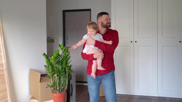 Father and daughter in the new apartment