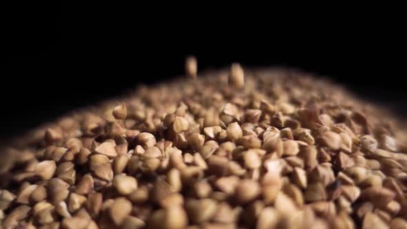 Buckwheat Groats Are Poured Into a Pile of Buckwheat