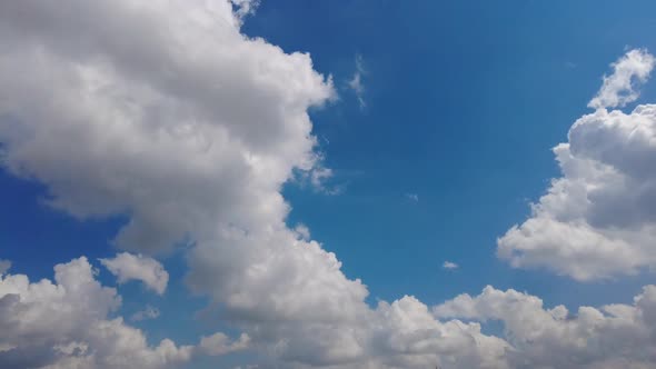 Timelapse Clouds Moving in the Blue Sky During Bright Sunny Summer Day