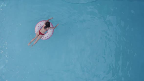 Alone Young Woman Student Daughter Chilling Relaxing Swimming Floating in Inflatable Tube Circle