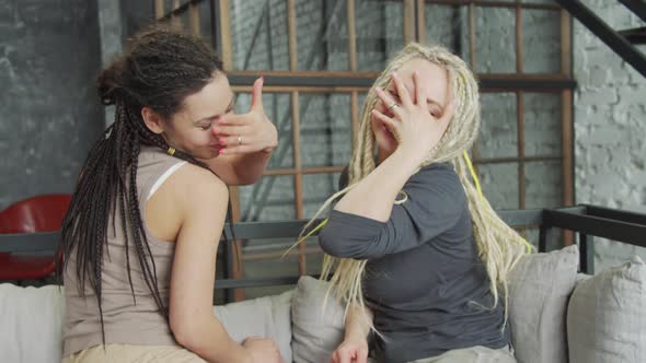 Beautiful Female Young Lesbian Couple Holding Each Other's Hands with the Ring