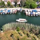 Dalyan - Mugla - Turkey, March 18, 2022, Moving boats with Mugla Dalyan view - VideoHive Item for Sale
