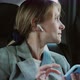 Beautiful Woman Passenger Using Smartphone or Listening Music in Wireless Headphones and Looking Out - VideoHive Item for Sale