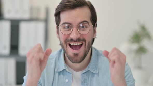 Portrait of Successful Young Man Celebrating