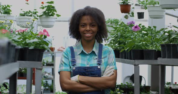 Female Gardener Smiling Into Camera