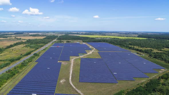 Landscape with Blue Solar Panels Field Aerial View