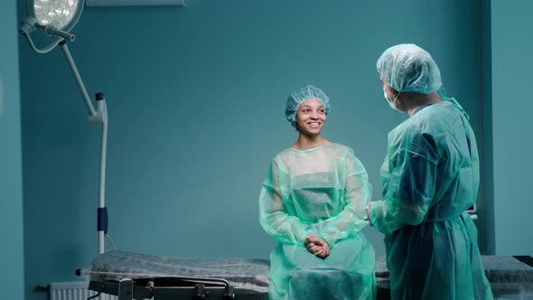 Woman Sits on the Couch in the Doctor's Office for a Rhinoplasty Consultation