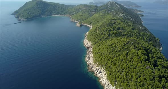 Close up aerial footage of Lopud Island in Croatia. Beautiful blue sea and skies on a sunny day