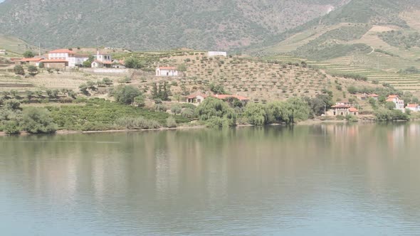 View of douro river and couple on balcony overlooking it