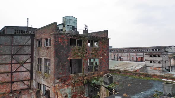 Abandoned factory with different buildings in industrial zone on the outskirts of the city