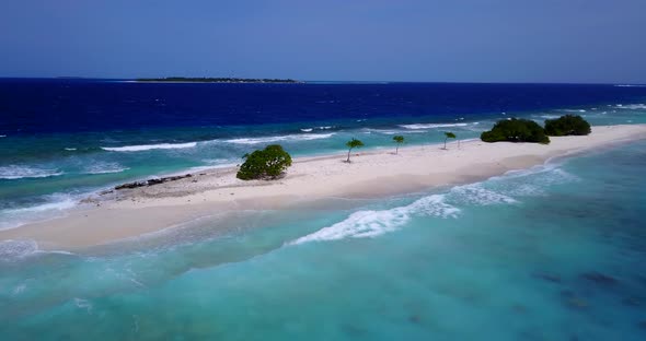 Luxury above tourism shot of a white sand paradise beach and turquoise sea background in vibrant