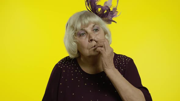 Funny Stupid Senior Old Woman Picking Nose with Silly Expression, Removing Boogers, Bad Manners