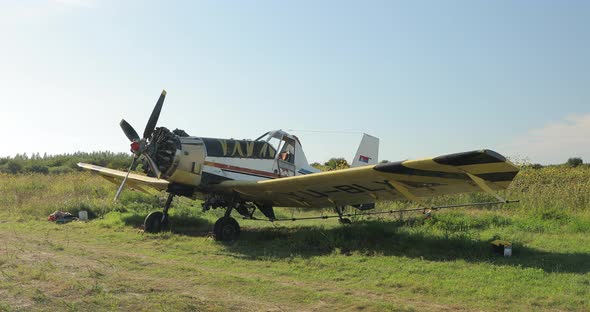 Old Colorful Plane with Wings Propeller Wheels Ready to Fly Standing