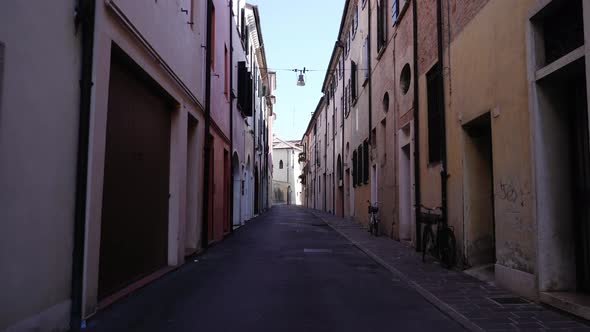 Small Local Street with Bicycles on Sidewalk at Buildings