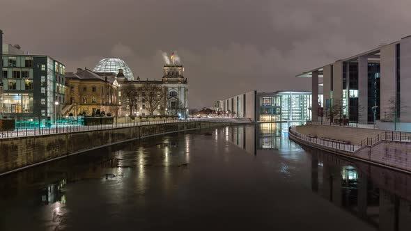 Snowy Night Time Lapse of Reichstag Building with Spree River, Berlin, Germany