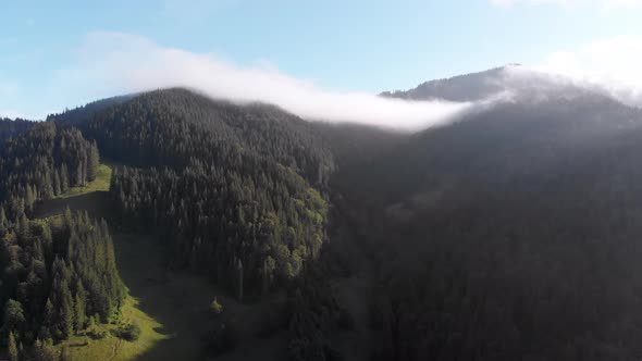 Aerial View of Dawn Over the Mountains. Fog and Clouds Hovered Mountain Tops