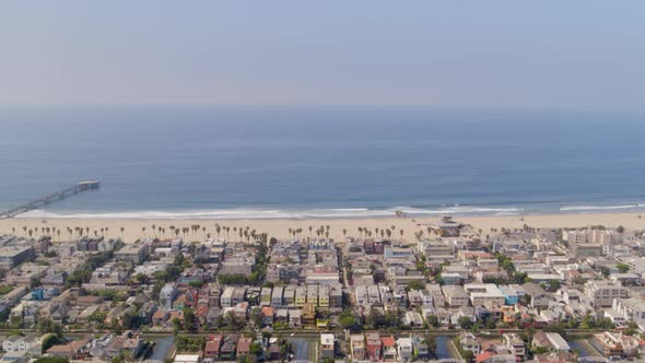 Aerial of residential blocks and calm sea in city