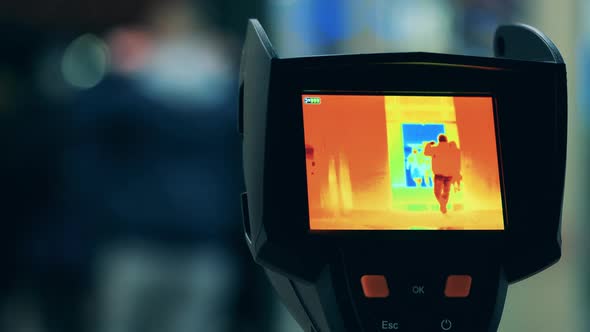 Screen of a Thermal Camera While Scanning Passers-by