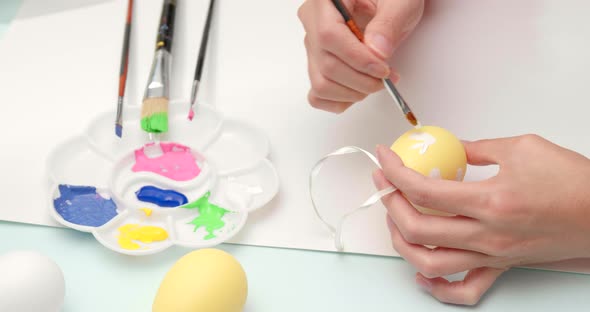 Painting on egg for Easter holiday