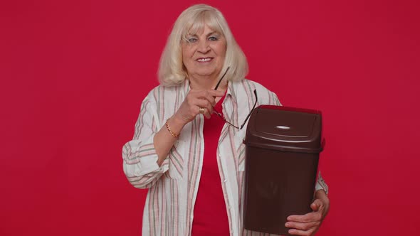 Smiling Senior Woman Taking Off Throwing Out Glasses Into Bin After Vision Laser Treatment Therapy