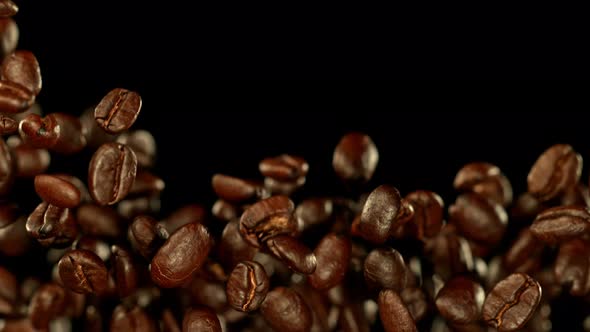 Super Slow Motion Shot of Exploding Premium Coffee Beans Towards the Camera at 1000Fps