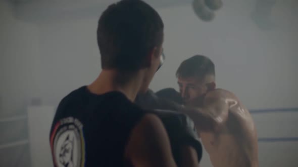 Super Lightweight Boxer Training with a Companion Using Punching Pads