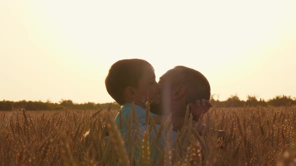 A Little Boy Embraces His Father. Happy Family, Fatherhood.